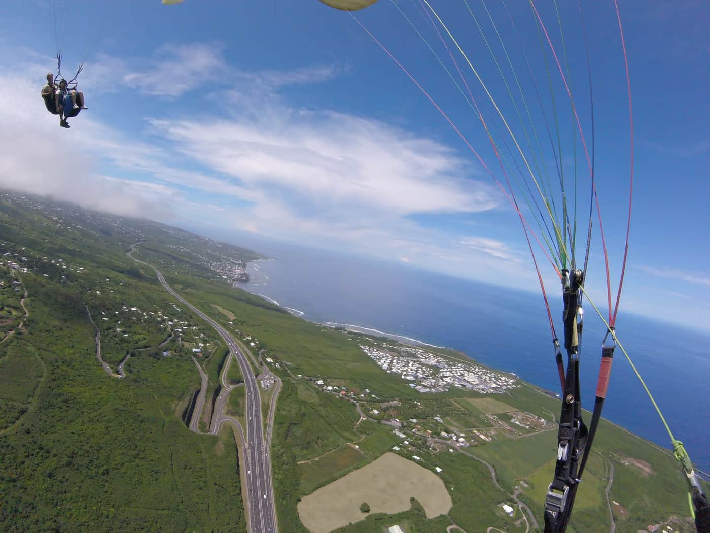 Tandem paragliding flight above Saint-Leu, Reunion Island